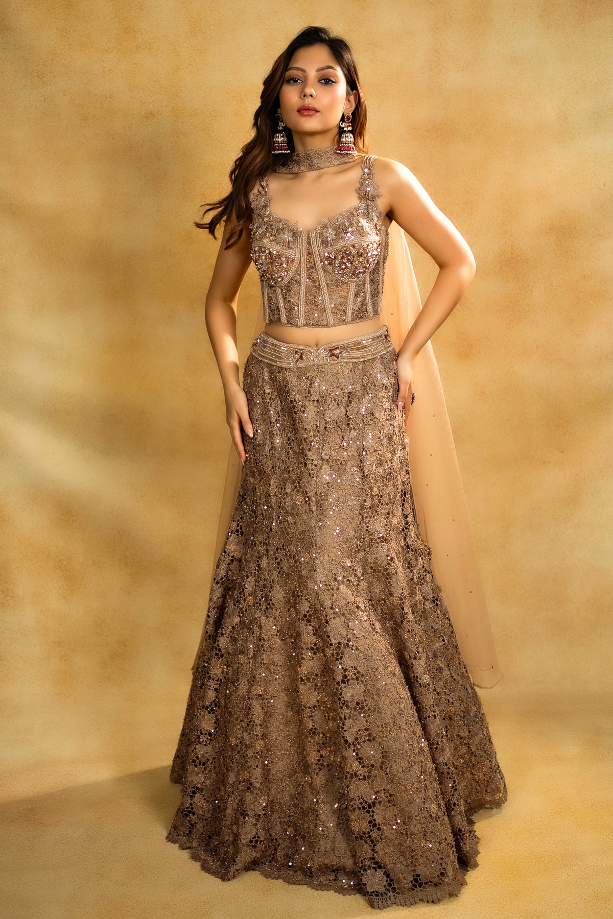 Designer Rose Gold Net Sequinned Fish Cut Lehenga with Corset Blouse for high-glam occasions