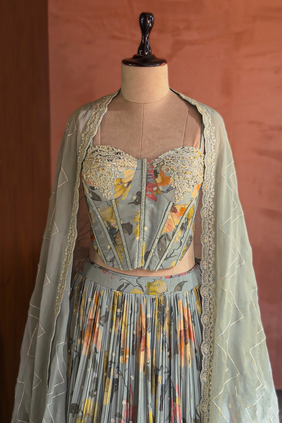 Light Sage Green Corset Lehenga paired with a sheer scalloped dupatta
