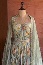 Light Sage Green Corset Lehenga paired with a sheer scalloped dupatta