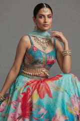 Close-up of artisanal shell detailing and sequins on the Turquoise Blue Crepe Silk Lehenga