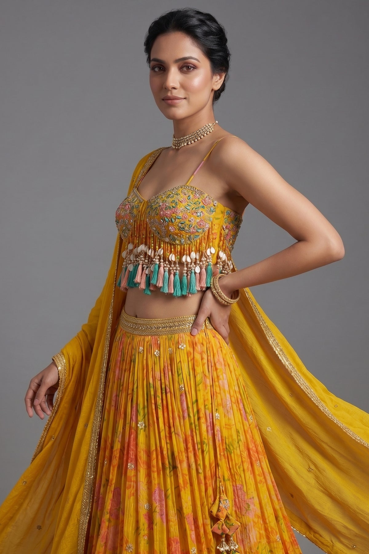 Close-up of mirror work and cowrie shells on the Amber Yellow Mustard Organza Printed Lehenga Set