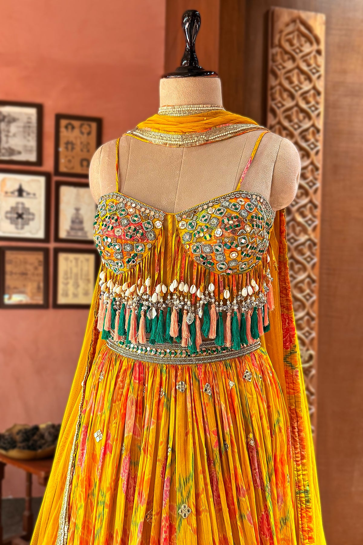 Amber Yellow Mustard Organza Printed Lehenga Set paired with a sheer net dupatta