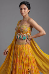 Close-up of mirror work and cowrie shells on the Amber Yellow Mustard Organza Printed Lehenga Set