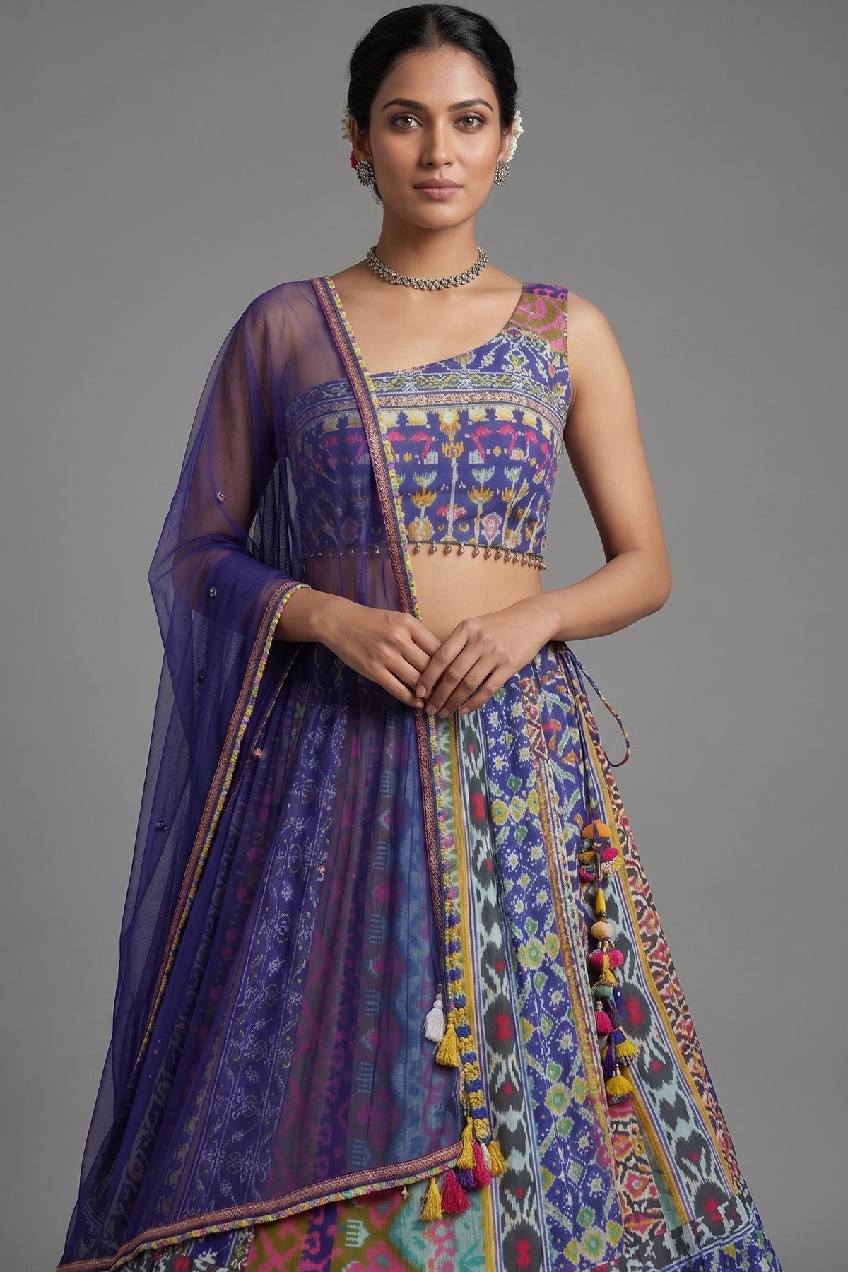Close-up of shimmering sequins and mirrors on the Blue Crepe Silk Printed Asymmetric Neckline Lehenga Set