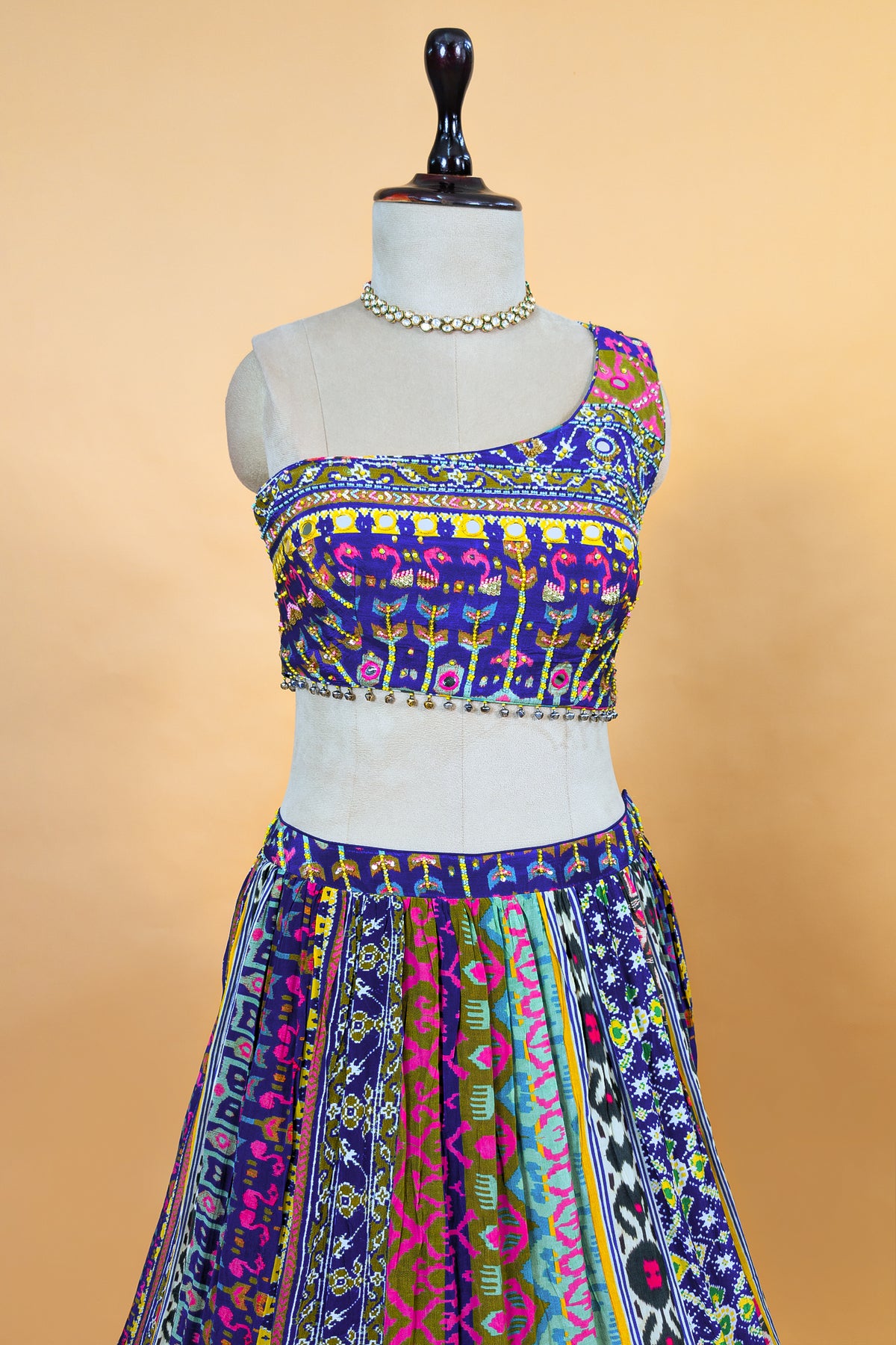 Blue Crepe Silk Printed Asymmetric Neckline Lehenga Set paired with a sheer net dupatta
