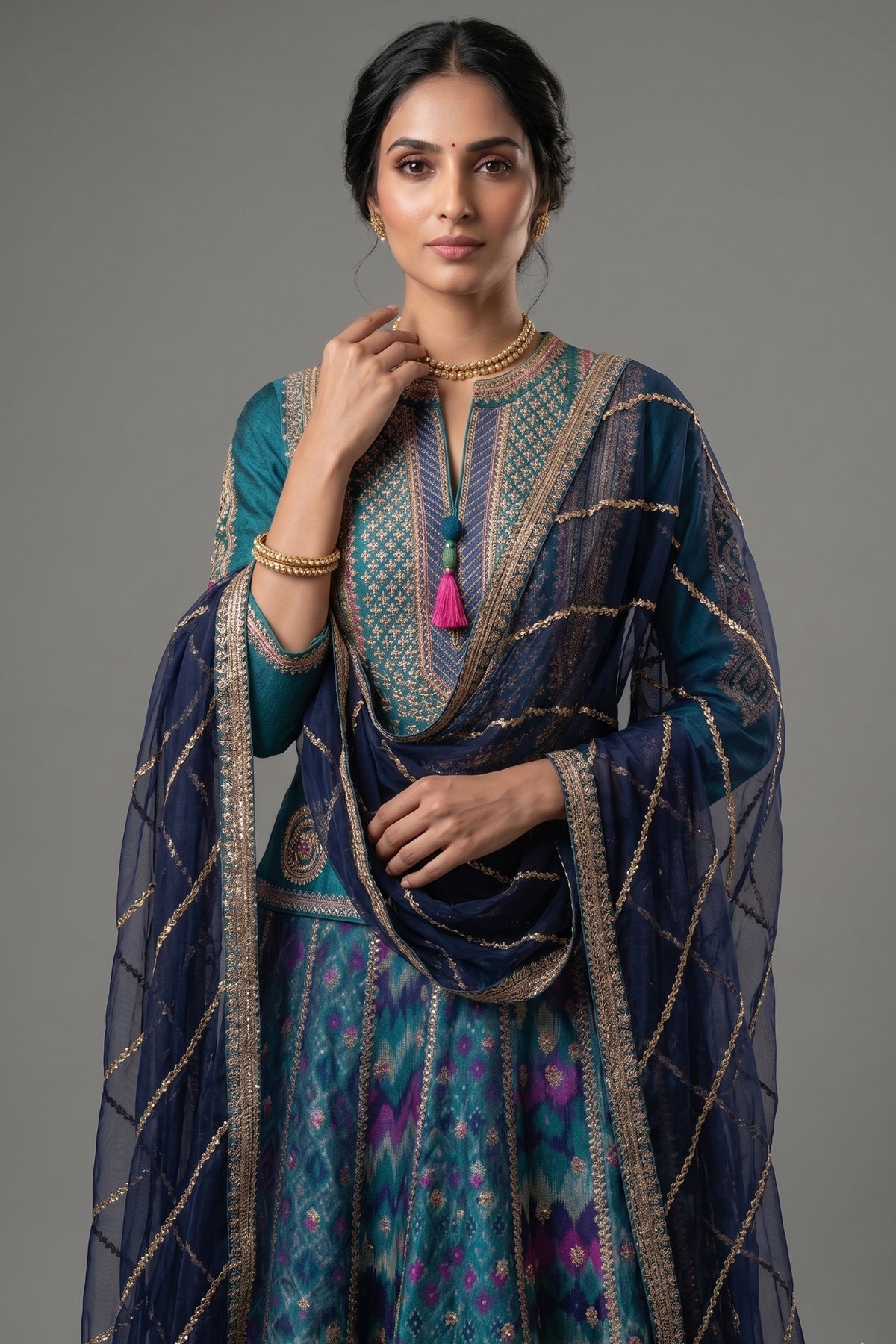 Close-up of golden Zardosi embroidery on the Peacock Blue Silk Sequin Embroidered Lehenga Set