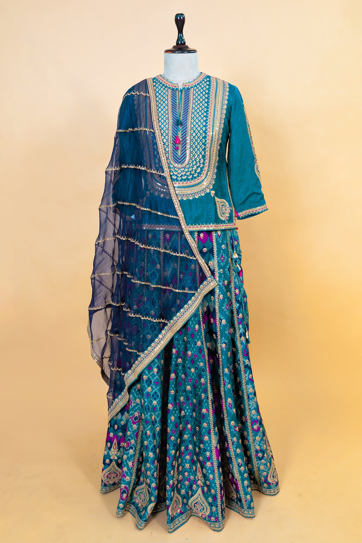 Peacock Blue Silk Sequin Embroidered Lehenga Set featuring a Patola-inspired print skirt