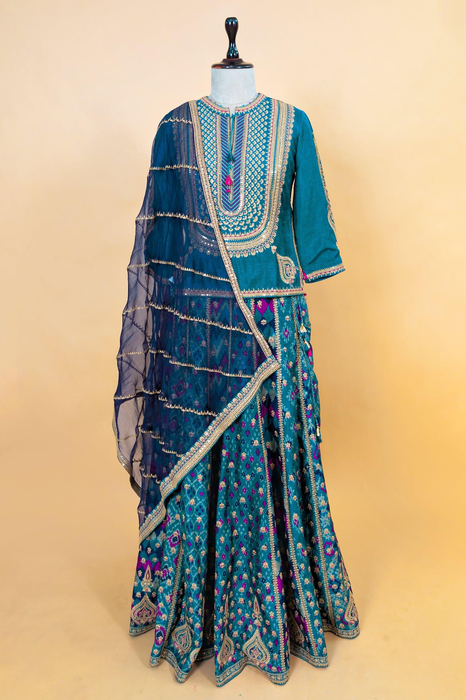 Peacock Blue Silk Sequin Embroidered Lehenga Set featuring a Patola-inspired print skirt