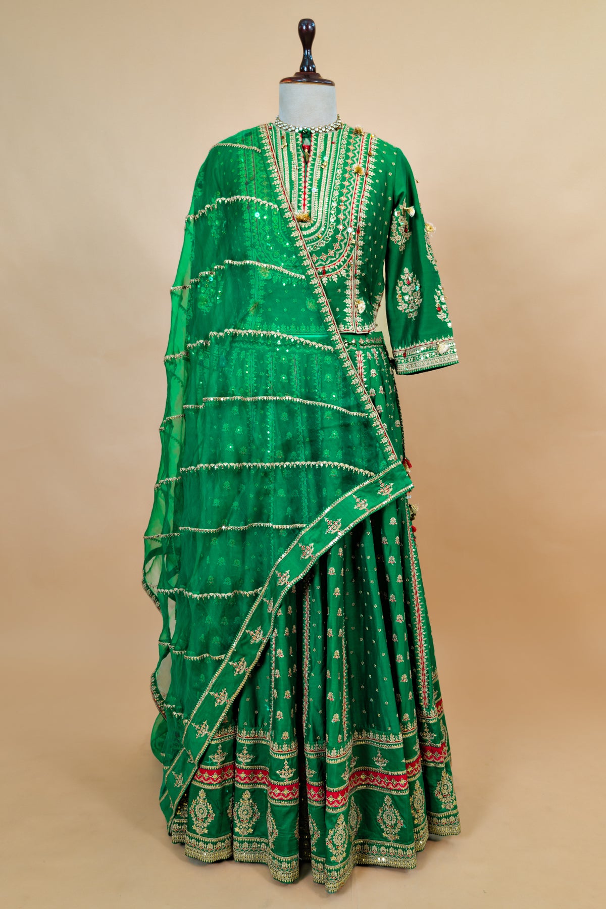 Close-up of the tailored kurti blouse on the Dark Green Silk Sequin Embroidered Lehenga Set