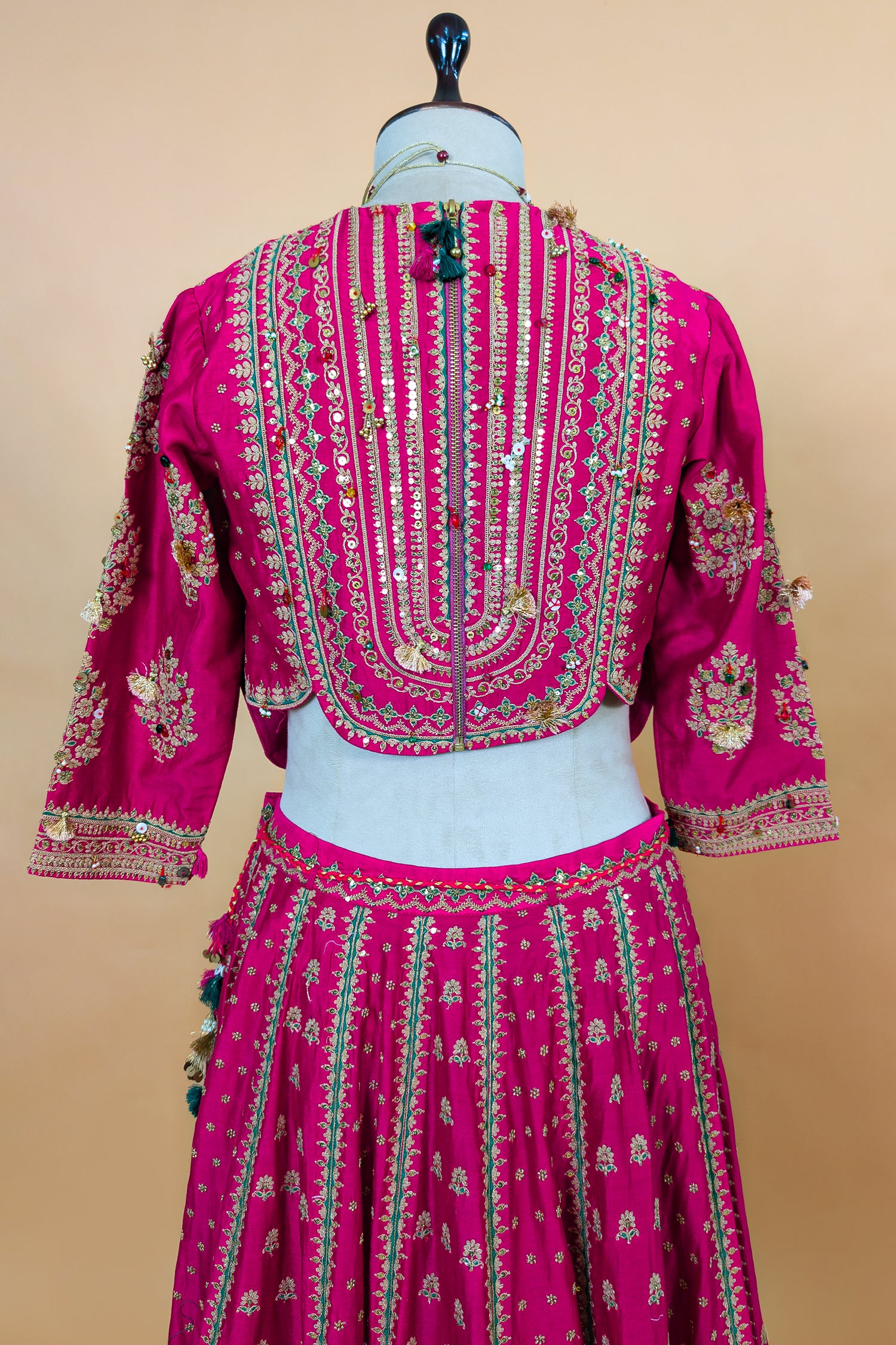 Close-up of golden Zardosi and beadwork on the Rani Pink Silk Sequin Embroidered Lehenga Set