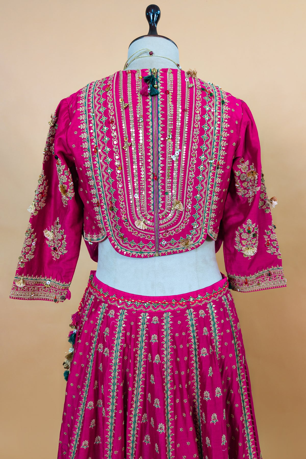 Close-up of golden Zardosi and beadwork on the Rani Pink Silk Sequin Embroidered Lehenga Set