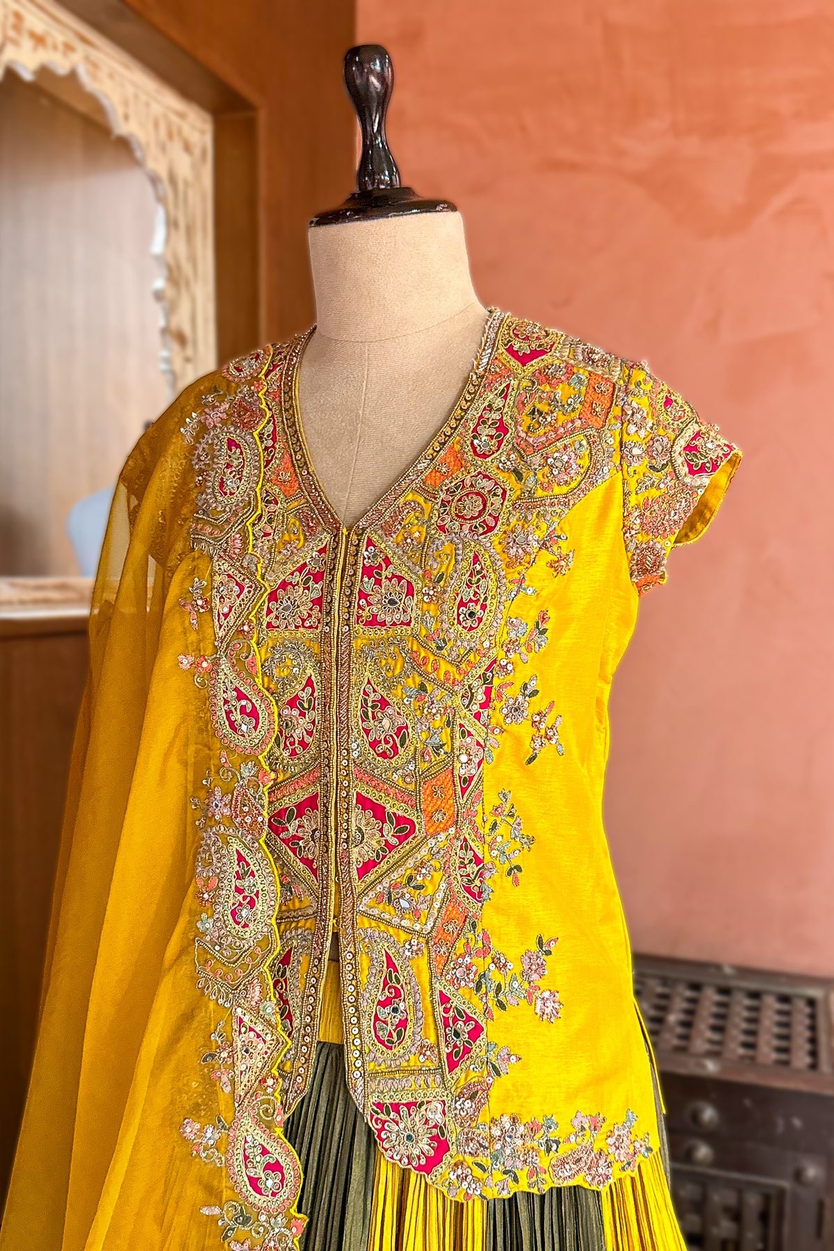 Multi Colored Chinon Shimmer Lehenga with an olive green pleated skirt