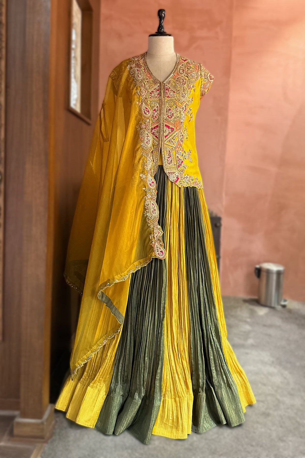 Close-up of the yellow embroidered jacket on the Multi Colored Chinon Shimmer Lehenga