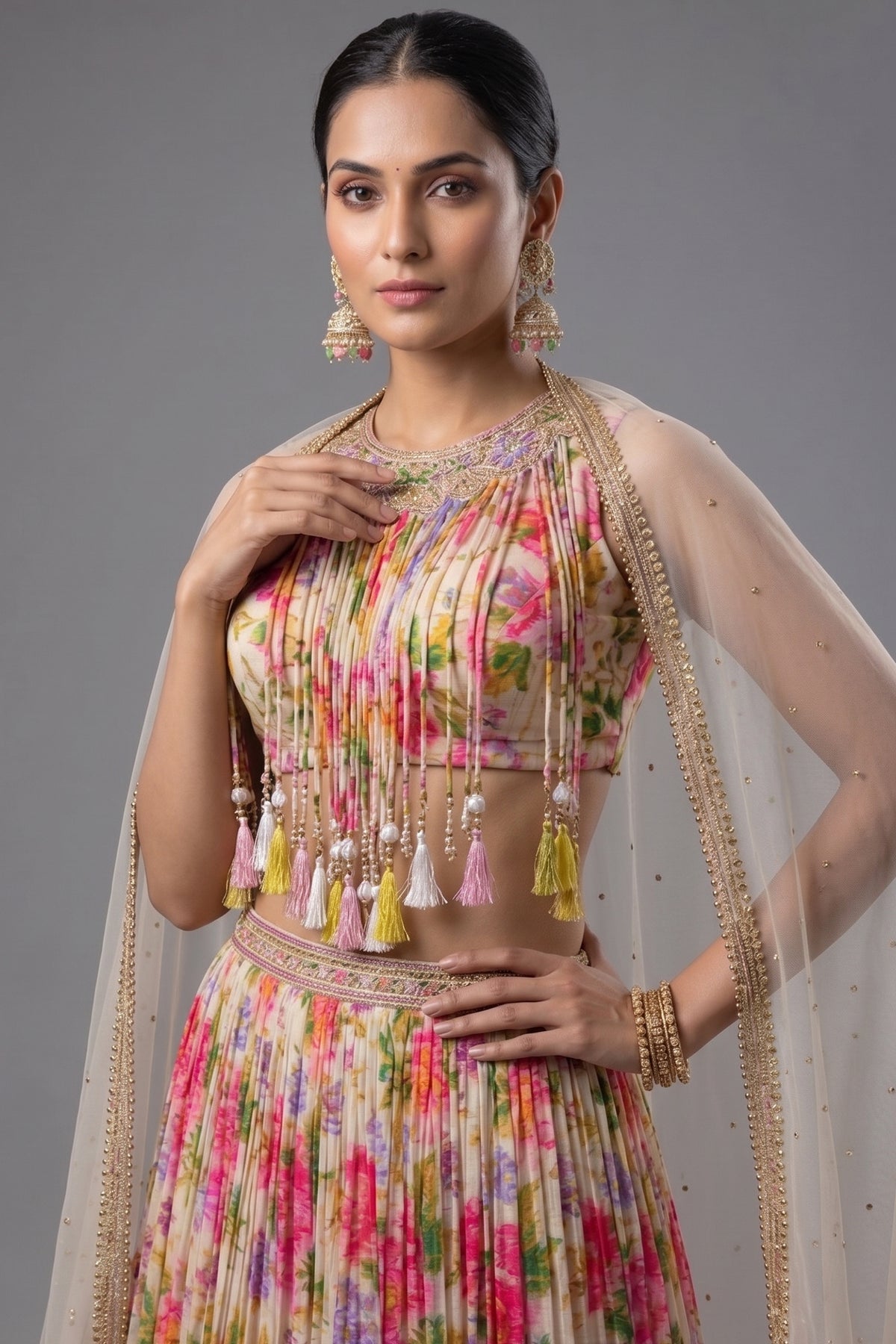 Close-up of mirror and bead embellishments on the jewel-neck blouse of the Ivory White Chinon Lehenga