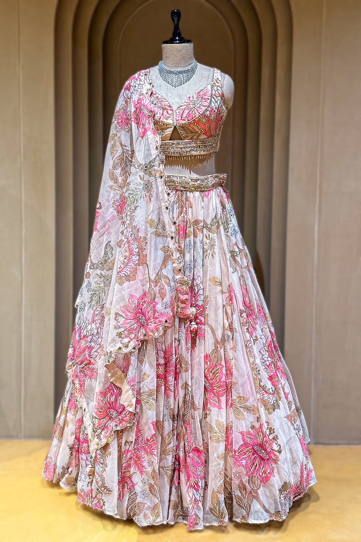 Close up of gold sequins and cutdana beadwork on Ivory Organza Lehenga