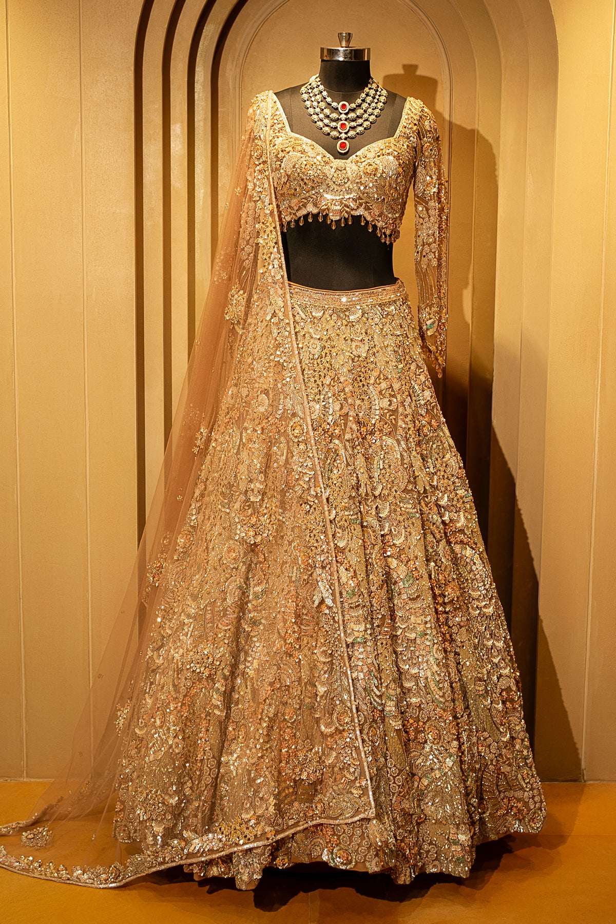 Close-up of shimmering sequins and cutdana on the Champagne Beige Net Lehenga