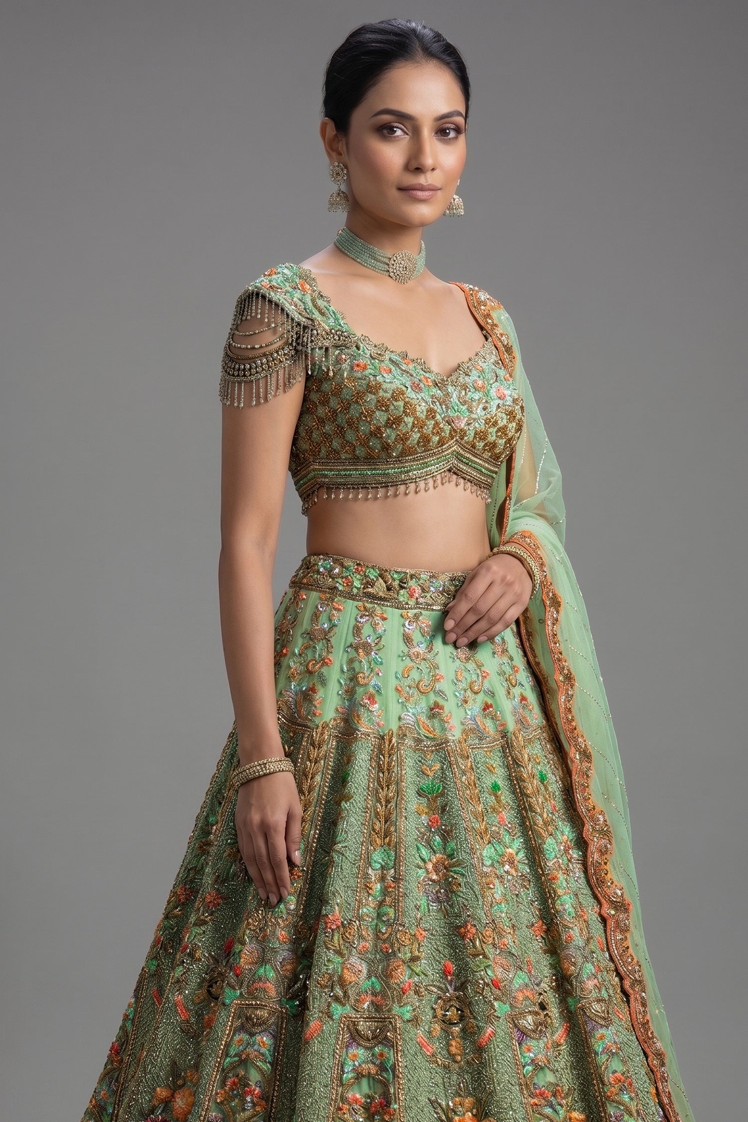 Close-up of shimmering sequins and cutdana on the Green Organza Designer Handworked Lehenga