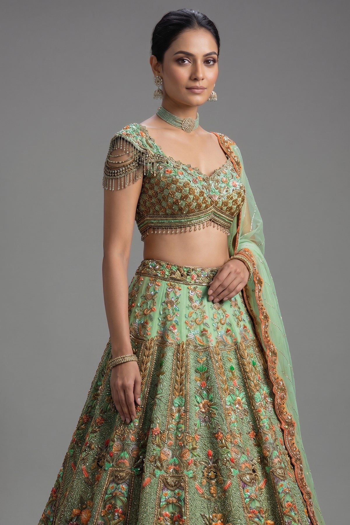 Close-up of shimmering sequins and cutdana on the Green Organza Designer Handworked Lehenga