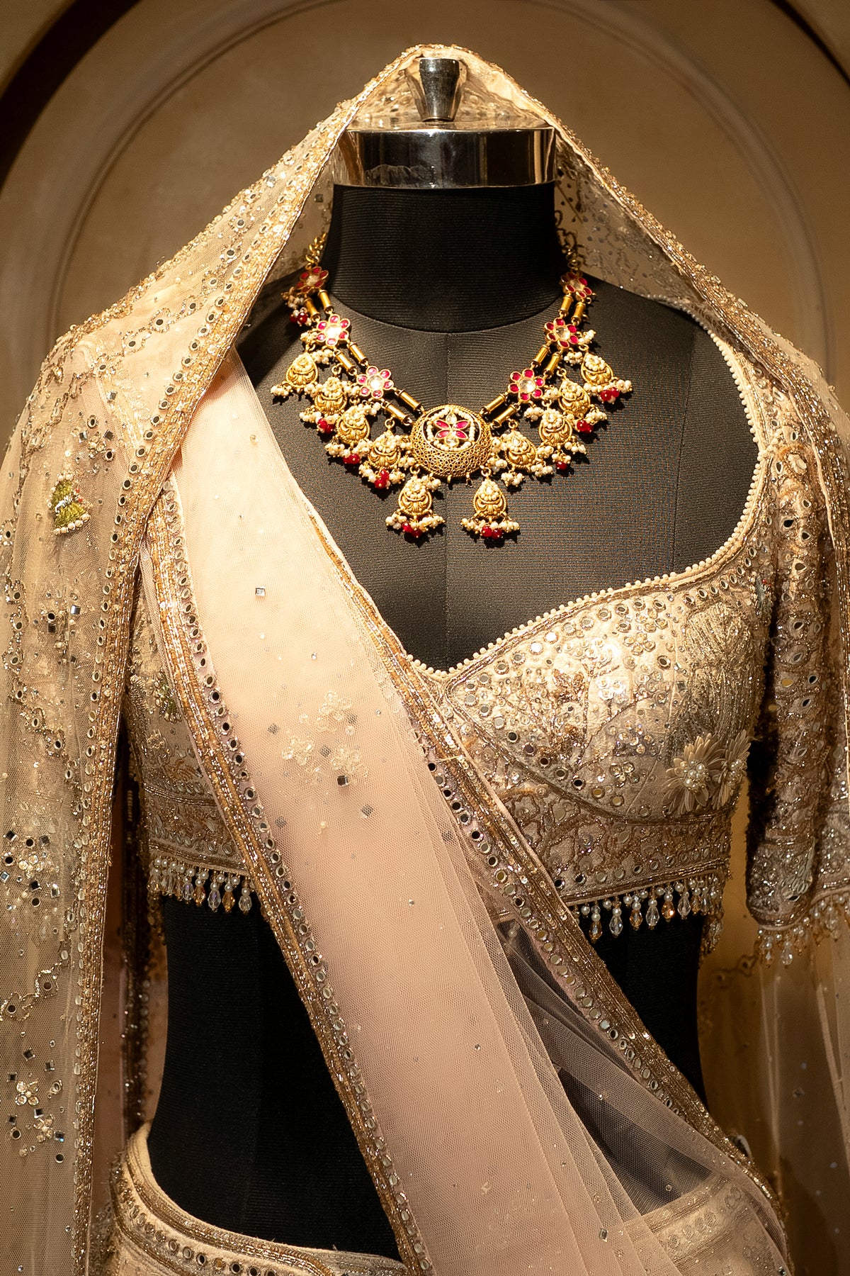 Mirror work and 3D floral accents on the Off White Silk Flamingo Lehenga