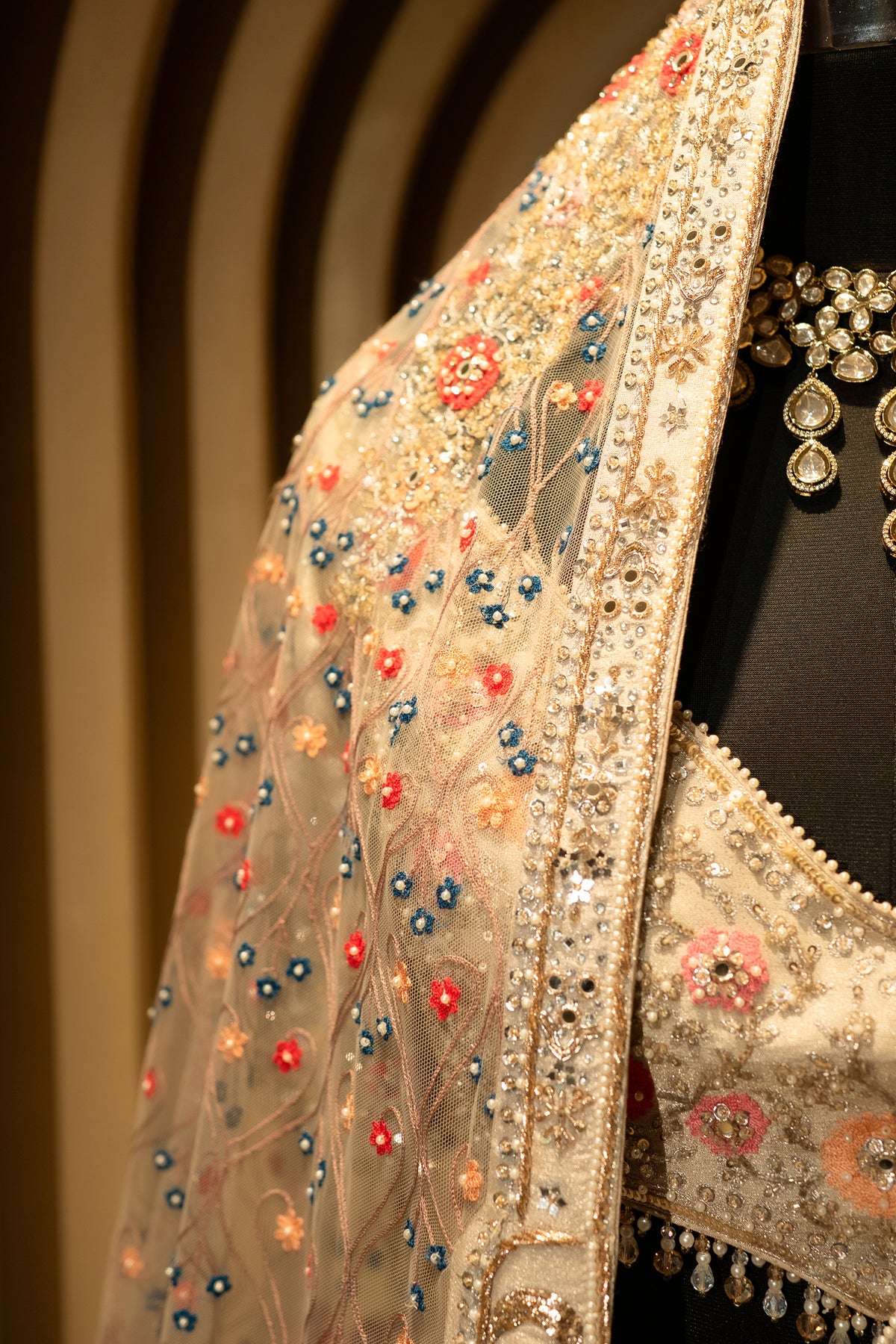 Ivory White Organza Lehenga paired with an embellished net blouse