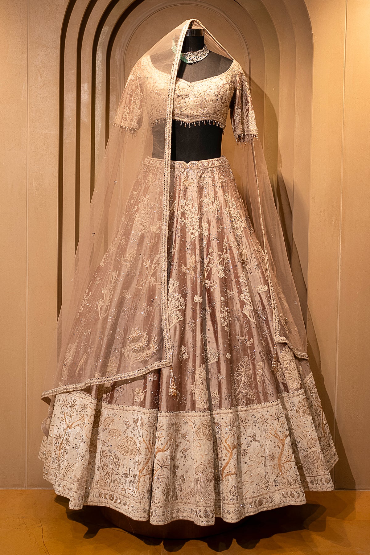 Close-up of fine dori embroidery on the Champagne Brown Silk Lehenga