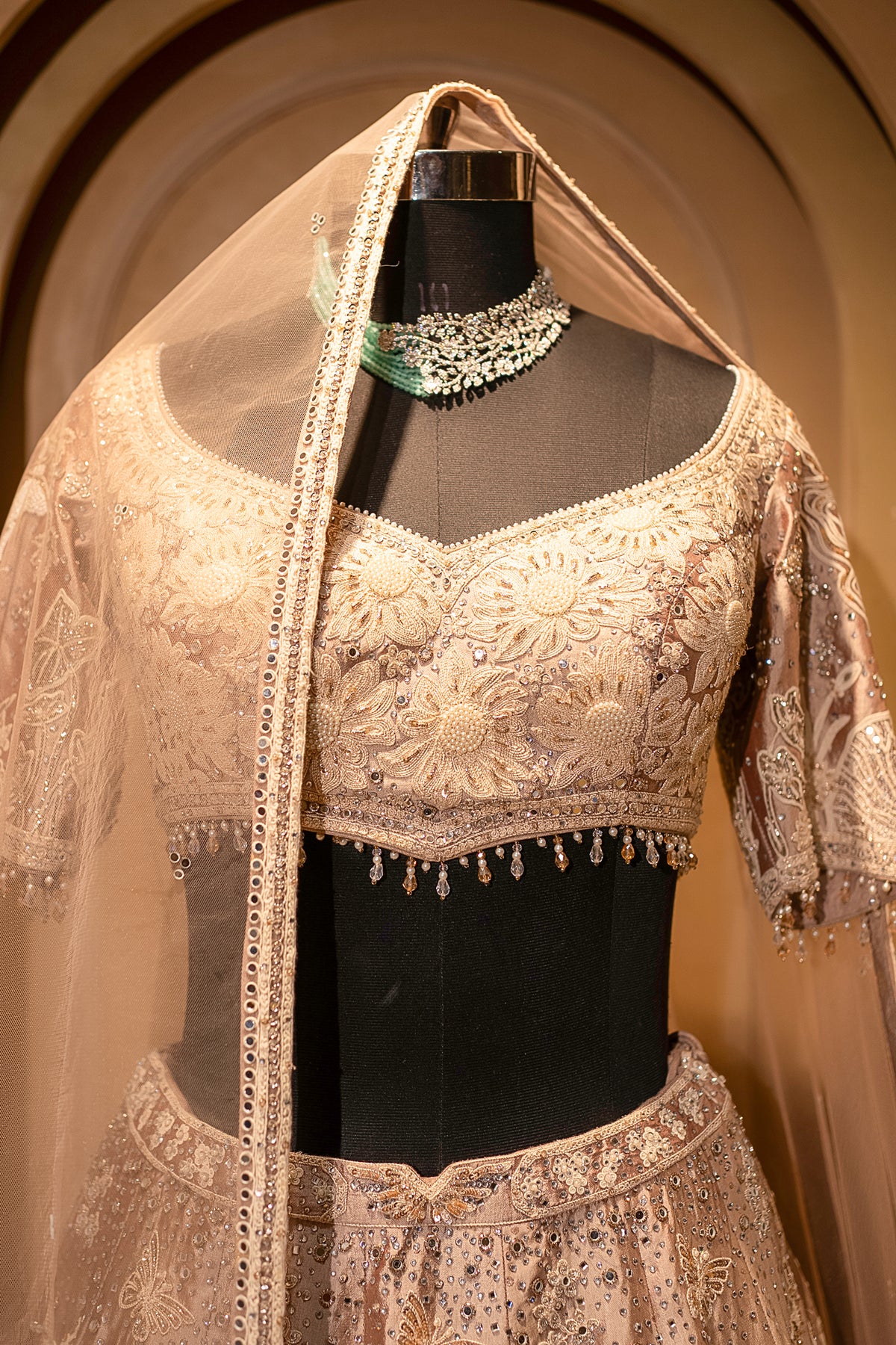Hand-placed mirror accents on the Champagne Brown Silk Lehenga