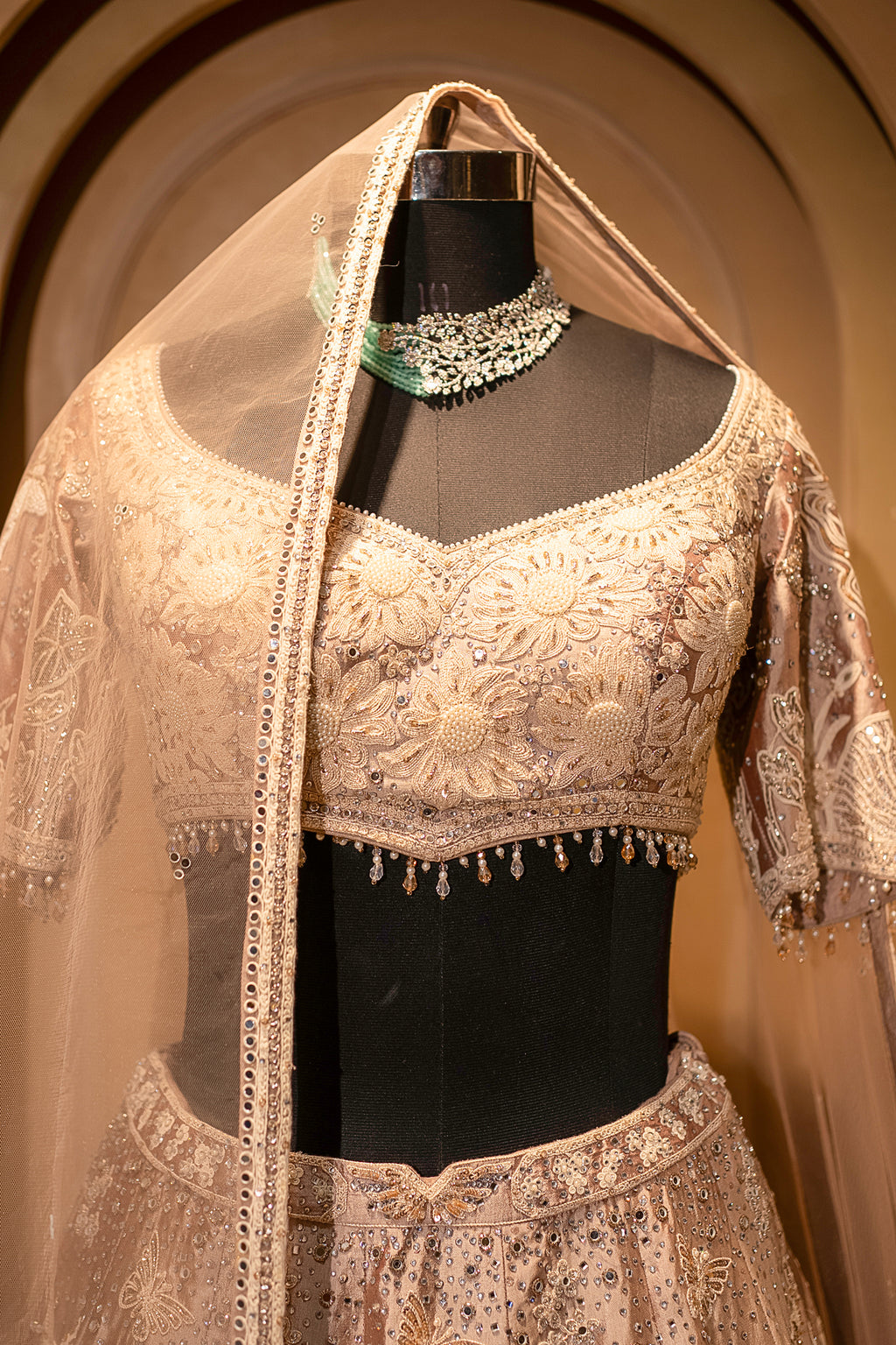 Hand-placed mirror accents on the Champagne Brown Silk Lehenga