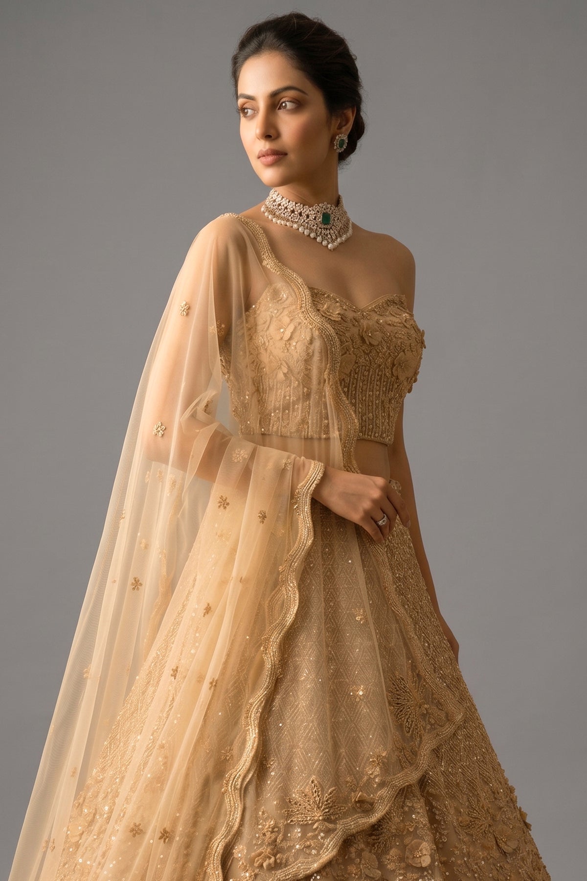 Close-up of 3D floral appliqués on the Champagne Gold Net Corset Lehenga