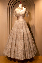 Ivory White Silk Bridal Lehenga with intricately embroidered blouse
