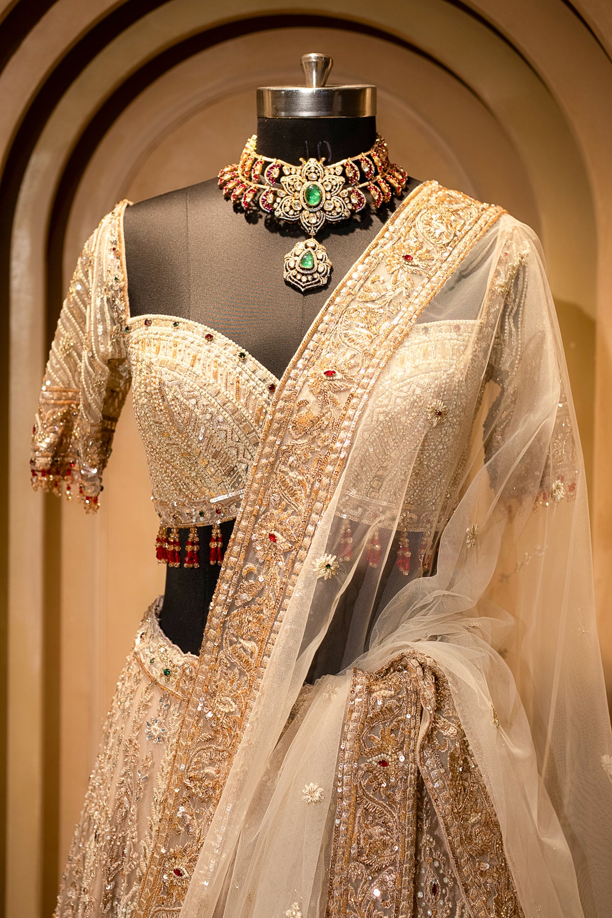Ethereal white veil details with the Beige Net Bridal Lehenga