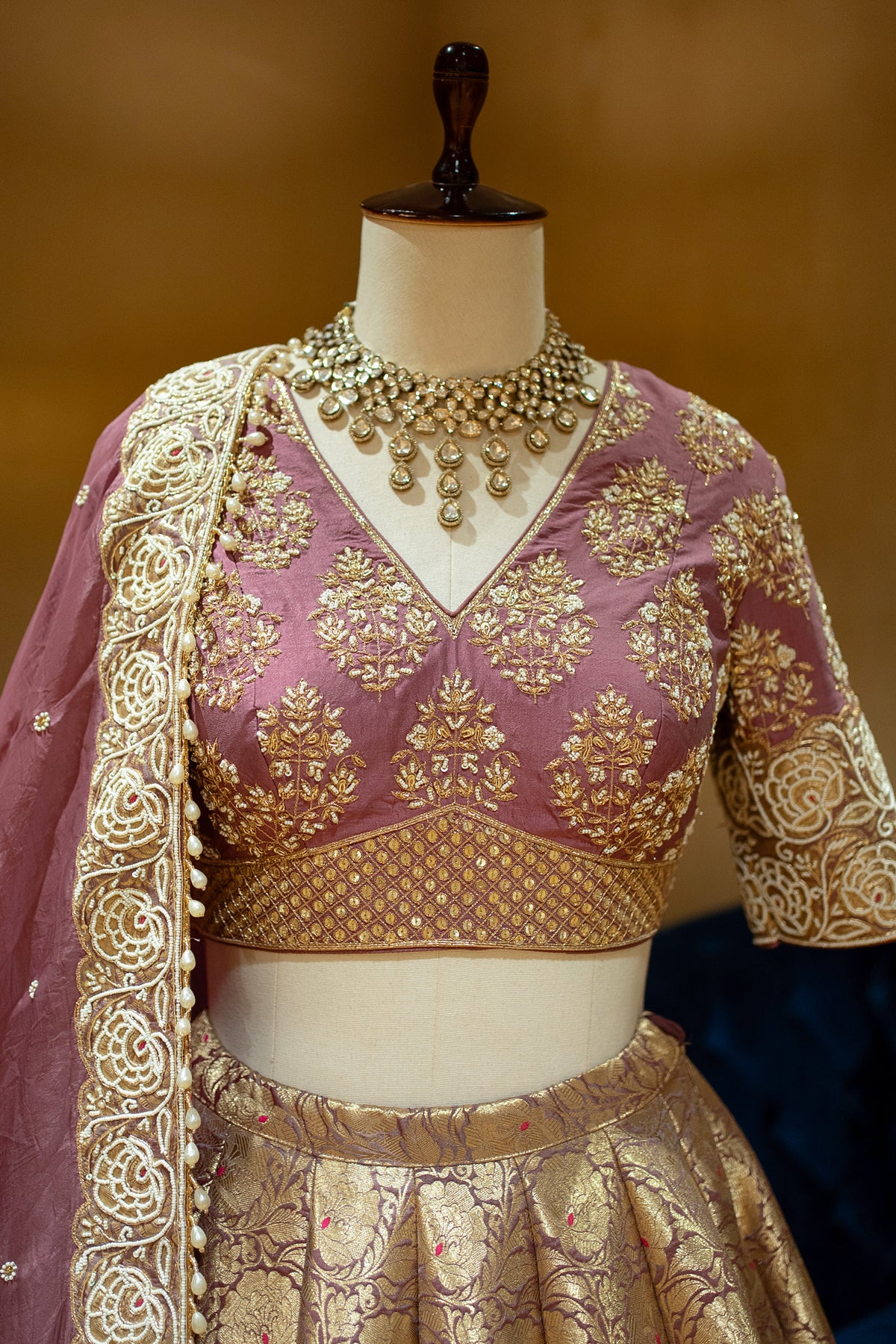 Hand-embellished blouse details on the Onion Pink Banarasi Bridal Lehenga