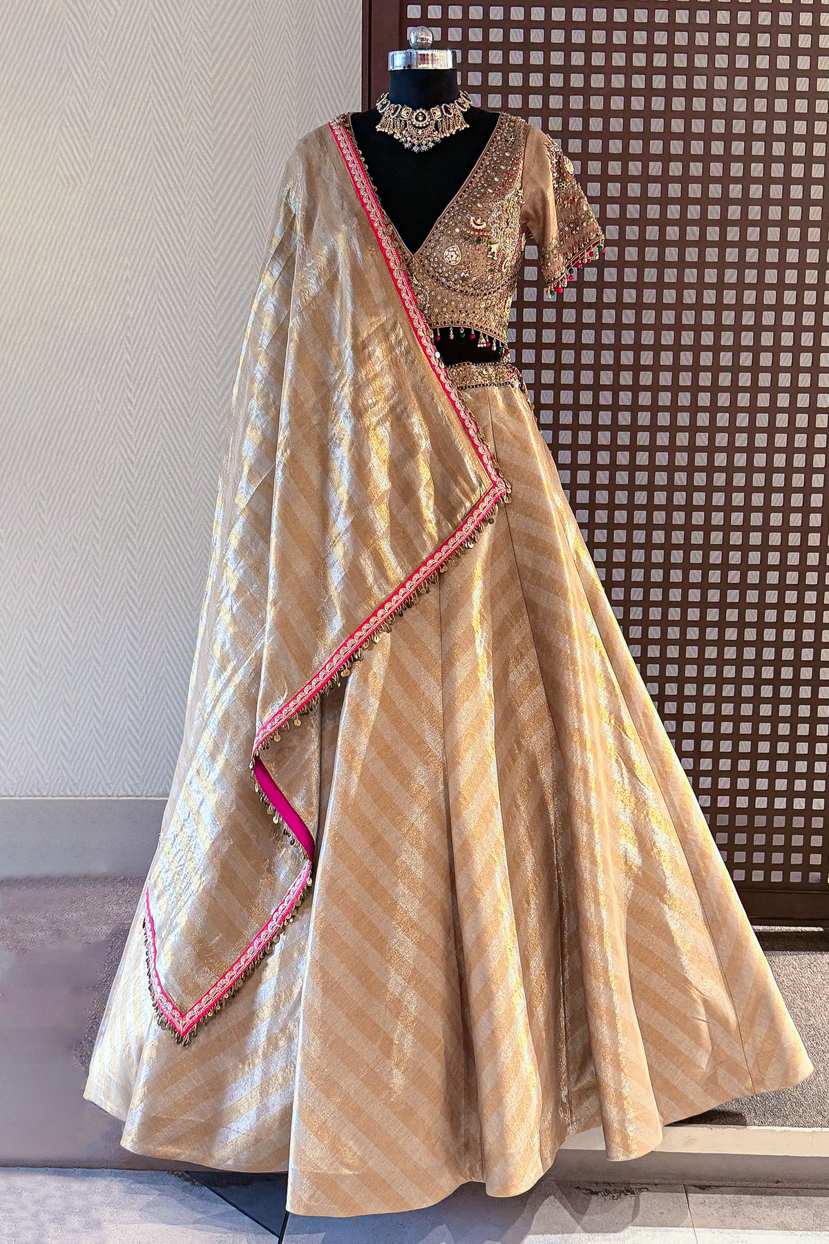 Golden Tissue Silk Lehenga back view featuring the bold contemporary circular cutout blouse