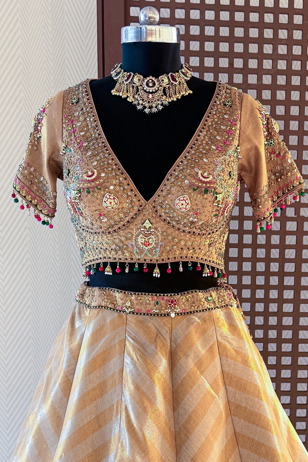Golden Tissue Silk Lehenga full length luxury wedding guest outfit look with chevron pattern