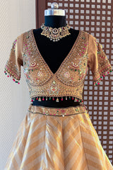 Golden Tissue Silk Lehenga full length luxury wedding guest outfit look with chevron pattern