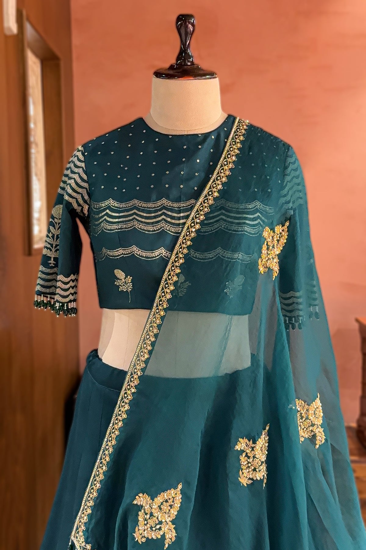 Bottle Green Silk Chevron Woven Kalidaar Lehenga with Pearl-Embellished Boat Neck Blouse