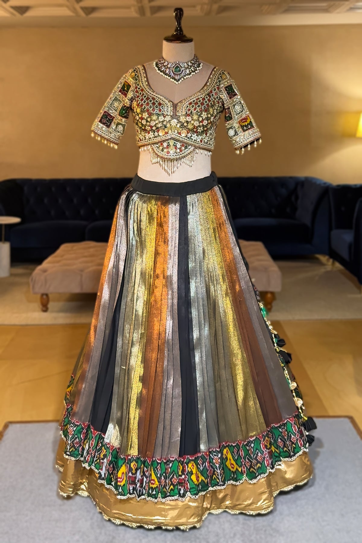 Sage Green Metallic Tissue Accordion Pleated Lehenga with Heritage Patola Weaving & Mirror-Work Blouse