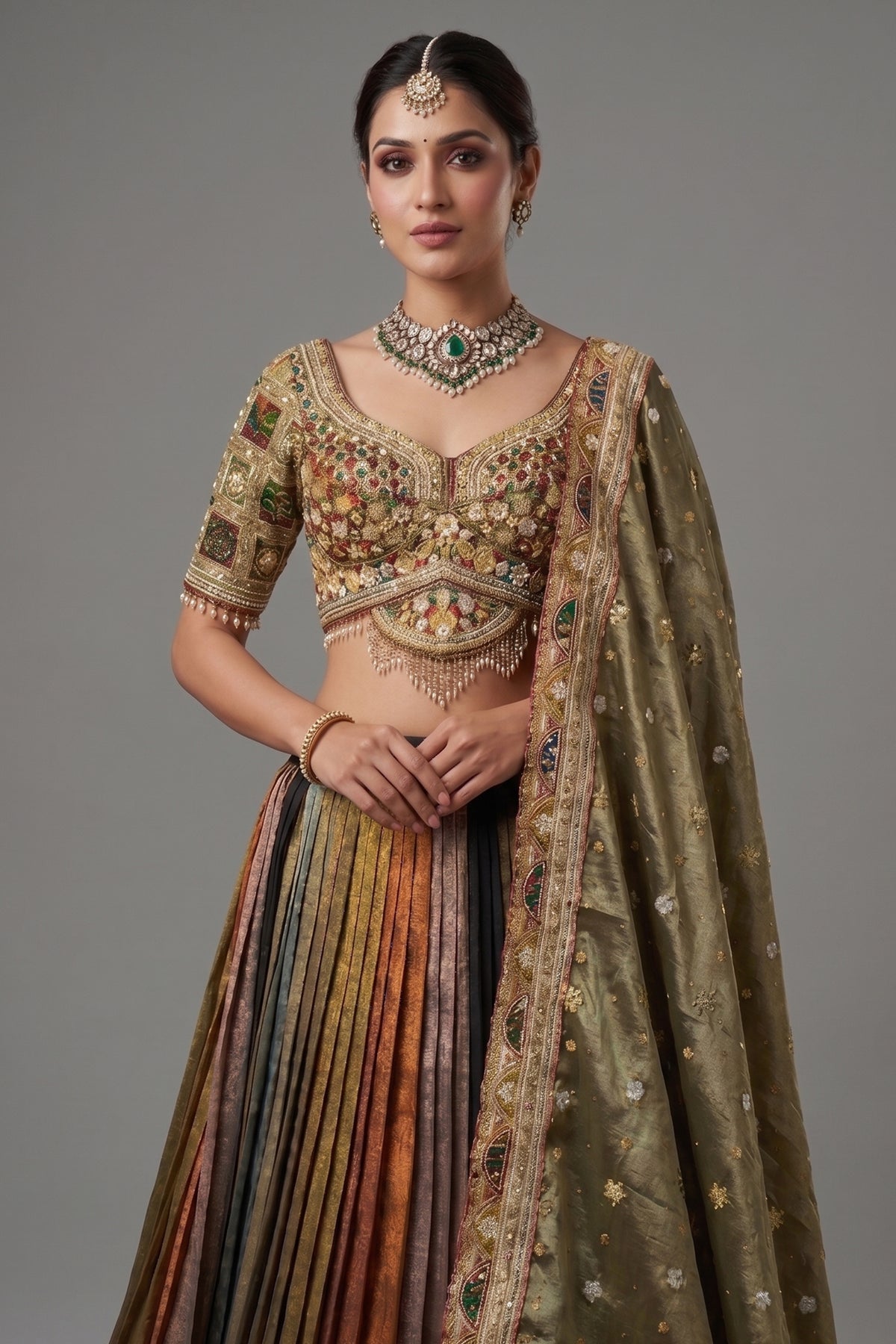 Sage Green Metallic Tissue Accordion Pleated Lehenga with Heritage Patola Weaving & Mirror-Work Blouse