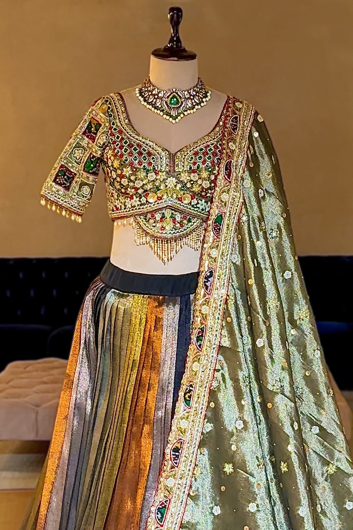 Sage Green Metallic Tissue Accordion Pleated Lehenga with Heritage Patola Weaving & Mirror-Work Blouse