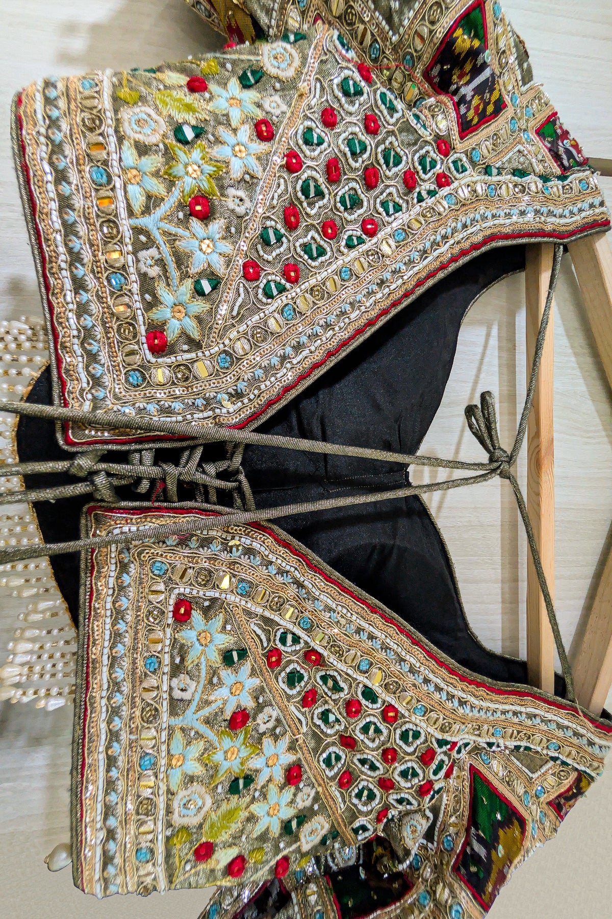 Sage Green Metallic Tissue Accordion Pleated Lehenga with Heritage Patola Weaving & Mirror-Work Blouse