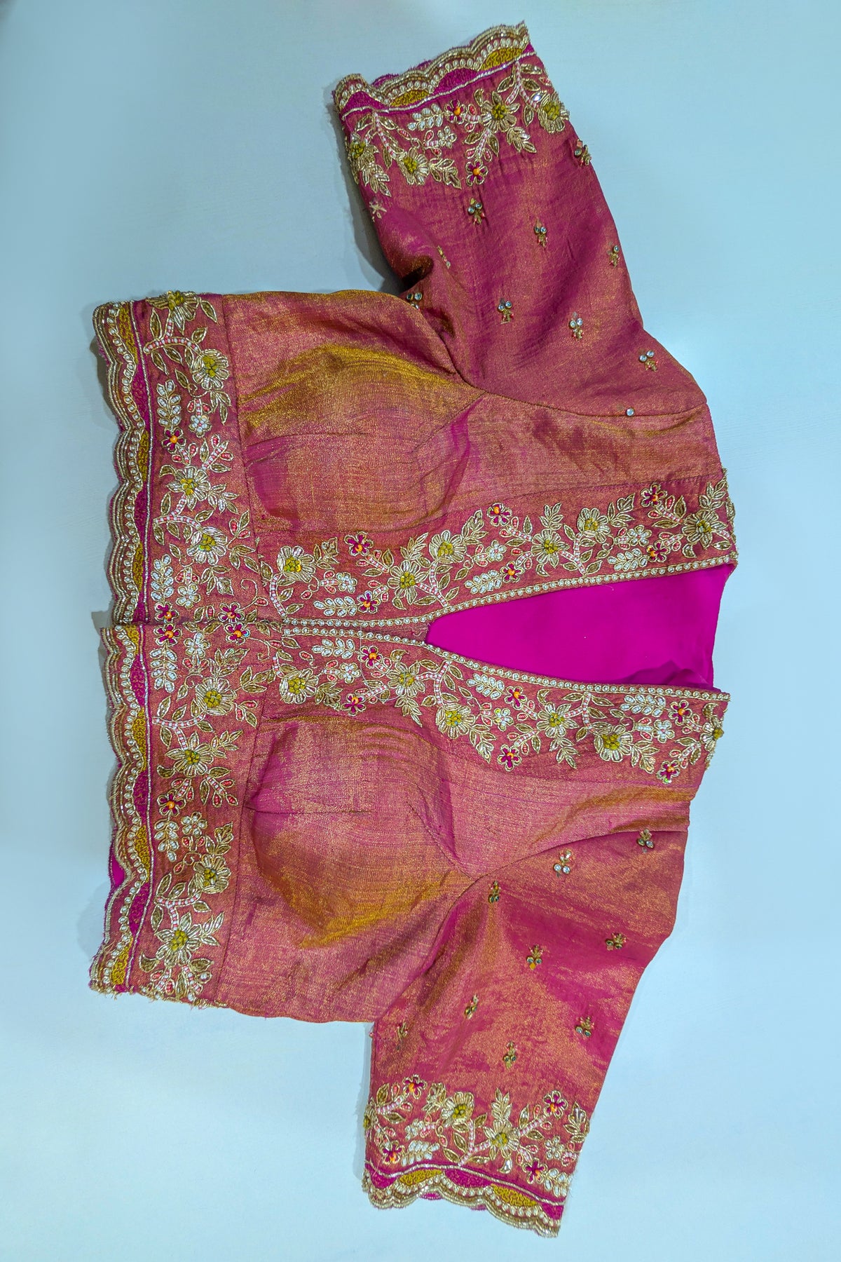 Cream and Fuchsia Two-Tone Tissue Silk Pleated Patola Ikkat Lehenga with Hand-Embellished Zardosi V-Neck Blouse