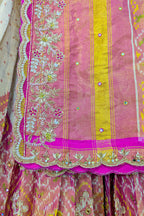 Cream and Fuchsia Two-Tone Tissue Silk Pleated Patola Ikkat Lehenga with Hand-Embellished Zardosi V-Neck Blouse