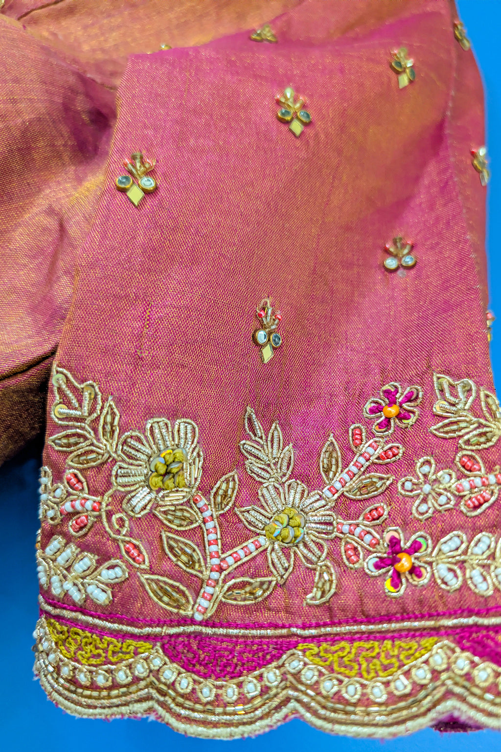 Cream and Fuchsia Two-Tone Tissue Silk Pleated Patola Ikkat Lehenga with Hand-Embellished Zardosi V-Neck Blouse