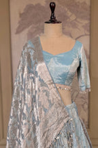 Icy Blue Metallic Tissue Silk Minimalist Lehenga Choli with Woven Banarasi Dupatta and Cowrie Shell Tassels