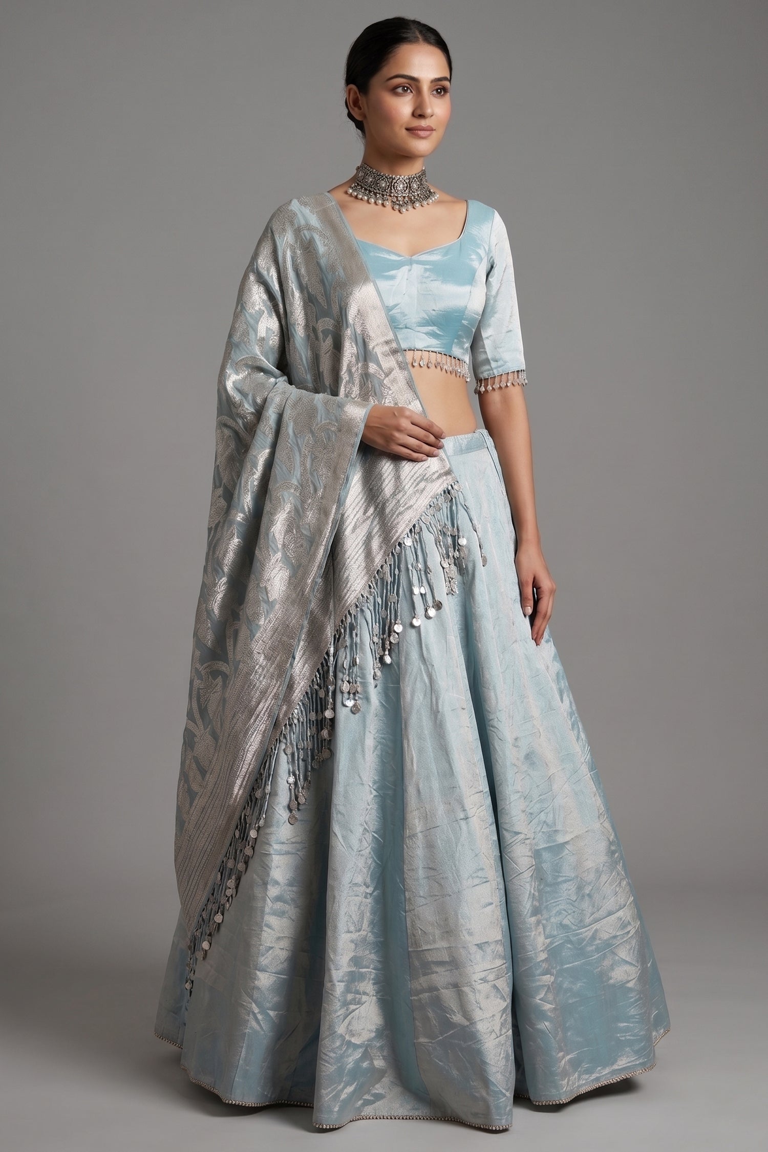 Icy Blue Metallic Tissue Silk Minimalist Lehenga Choli with Woven Banarasi Dupatta and Cowrie Shell Tassels Main image