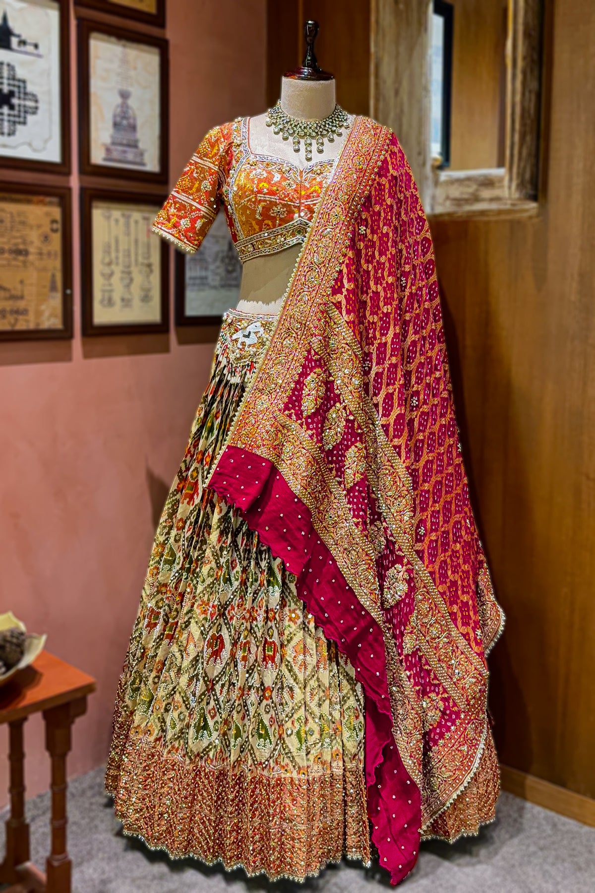 Cream and Golden Tissue Silk Heritage Patola Lehenga with Hand-Embroidered Zardosi Blouse and Georgette Bandhej Dupatta