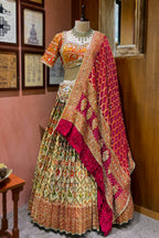 Cream and Golden Tissue Silk Heritage Patola Lehenga with Hand-Embroidered Zardosi Blouse and Georgette Bandhej Dupatta