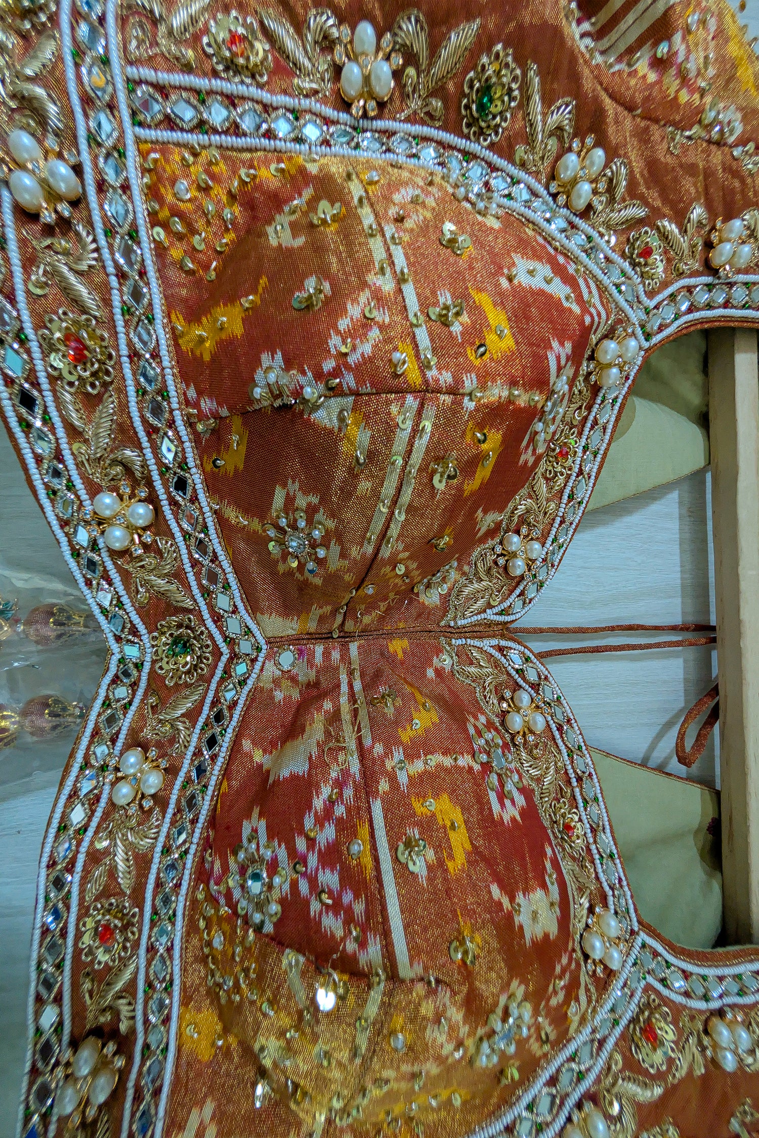 Cream and Golden Tissue Silk Heritage Patola Lehenga with Hand-Embroidered Zardosi Blouse and Georgette Bandhej Dupatta
