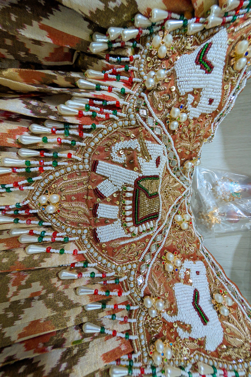 Cream and Golden Tissue Silk Heritage Patola Lehenga with Hand-Embroidered Zardosi Blouse and Georgette Bandhej Dupatta