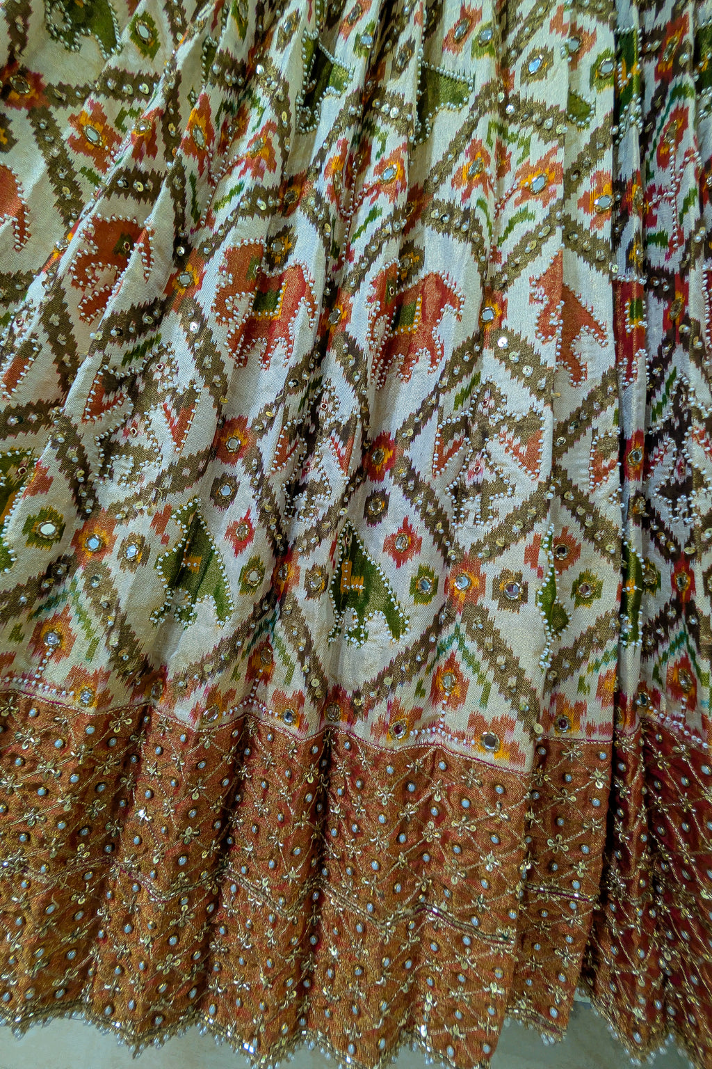 Cream and Golden Tissue Silk Heritage Patola Lehenga with Hand-Embroidered Zardosi Blouse and Georgette Bandhej Dupatta