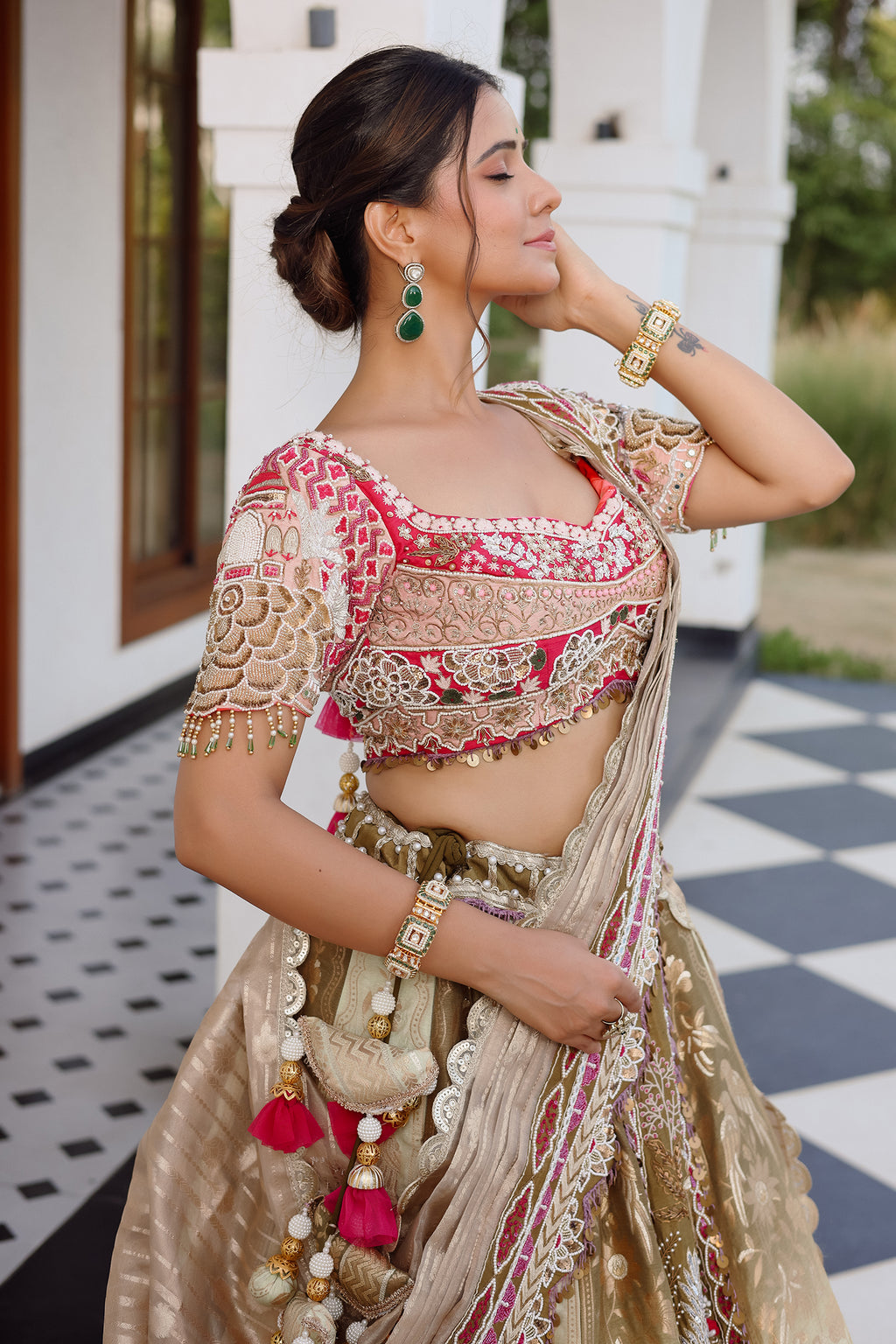 The Olive Green Shaded Brocade Silk Woven Lehenga Ensemble with Jharokha Embroidered Sweetheart Blouse and Attached Organza Dupatta